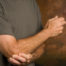 Image of chiropractic patient with tennis elbow pain.